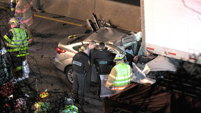 State Troopers examine the wreckage