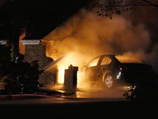 Car burning in house